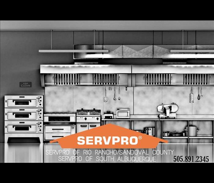 Kitchen equipment behind SERVPRO logo 